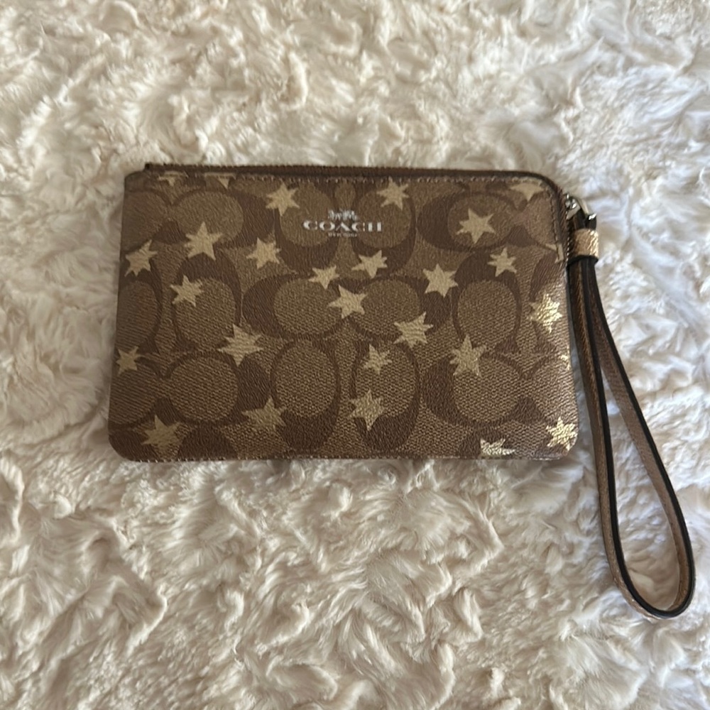 NWOT  
Coach Brown and Tan Wristlet with Star Design